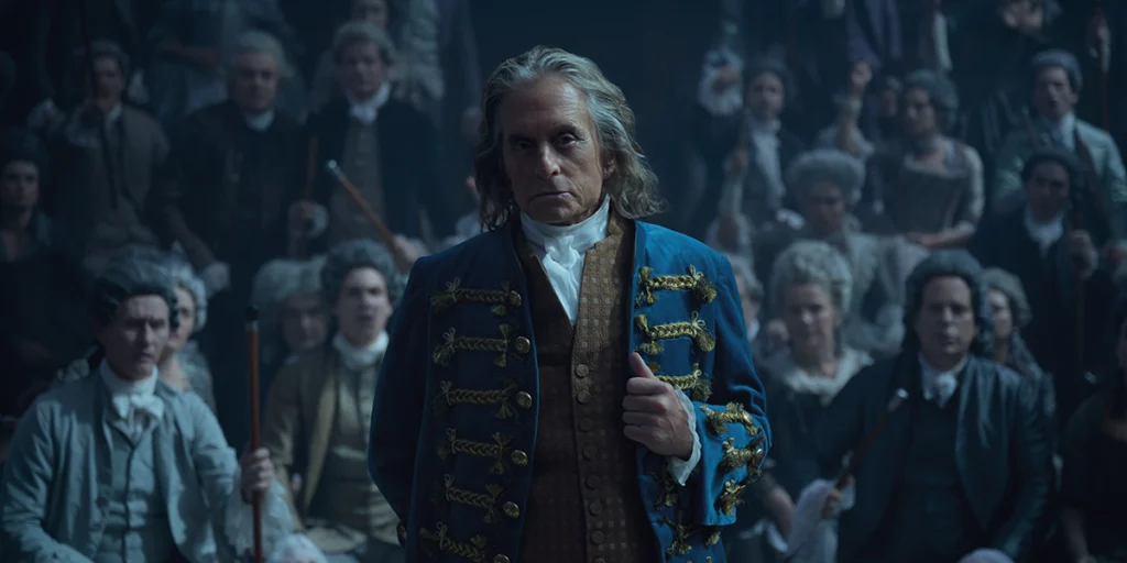 Benjamin Franklin stands in the middle of a crowd wearing a blue uniform in episode 4 of Franklin