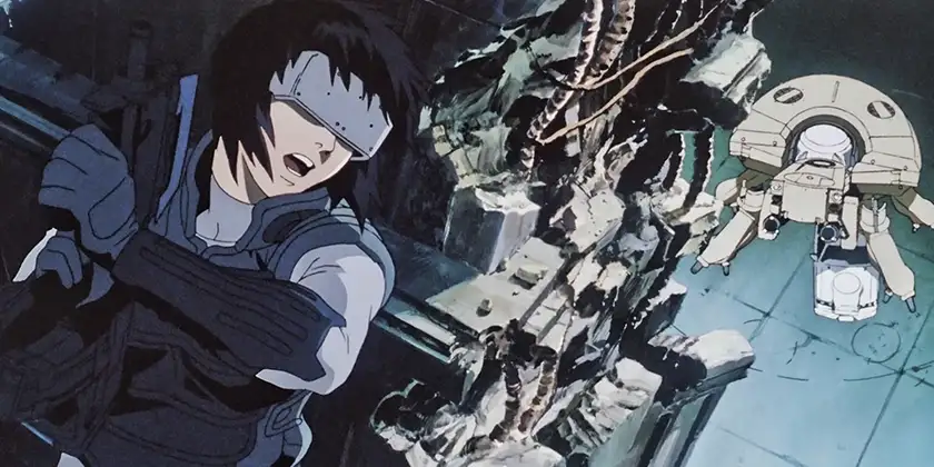 A character holds a gun with a visor on their heads while running from a robot in Ghost in the Shell, one of the animated movies about robots recommended by Loud and Clear Reviews
