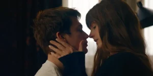 A man and a woman are about to kiss in a still from the movie The Idea of You