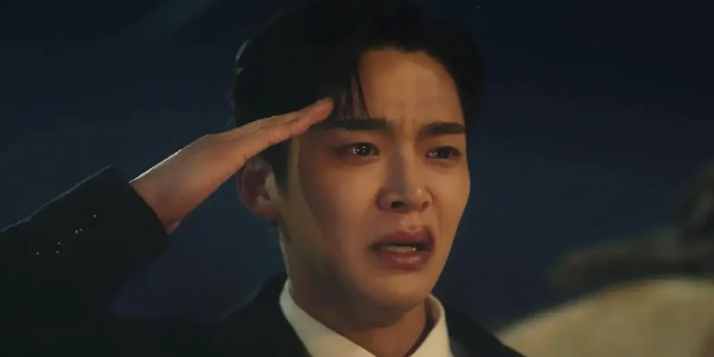 A young man cries while doing the military salute in a still from "Tomorrow", one of the K-Dramas that tell better stories than western media according to Loud and Clear Reviews