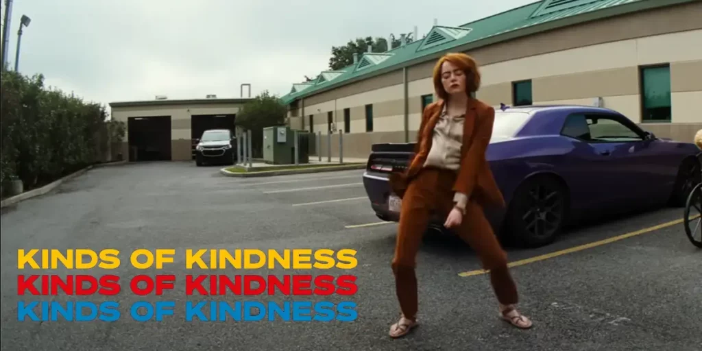 Emma Stone dances in a parking lot in Kinds of Kindness, a still used for Loud and Clear Reviews' article on everything we know about the movie