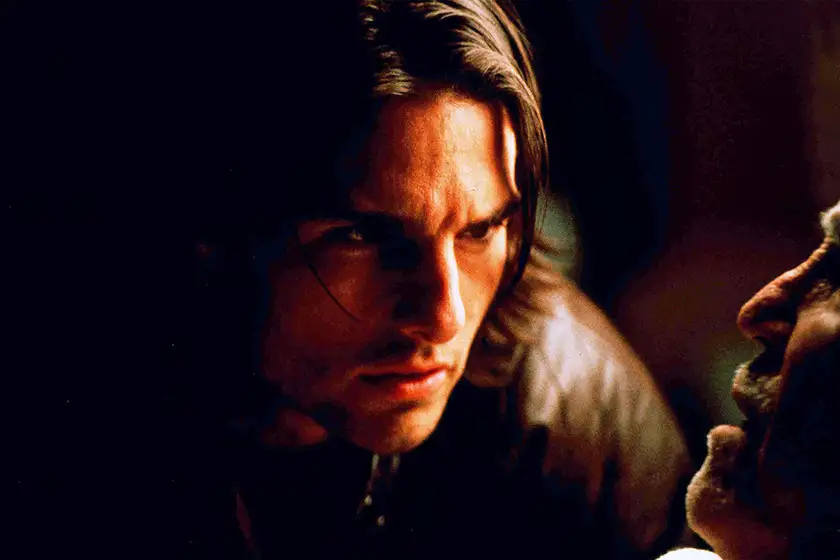 Tom Cruise looks at a man in a still from the movie Magnolia, which explores the theme of hope