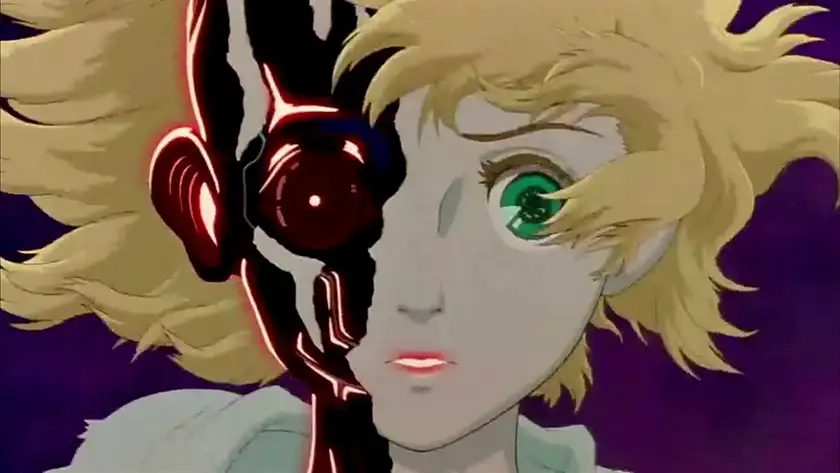 A blonde woman with green eyes is shown but half of her face is missing and underneath there's a black robot