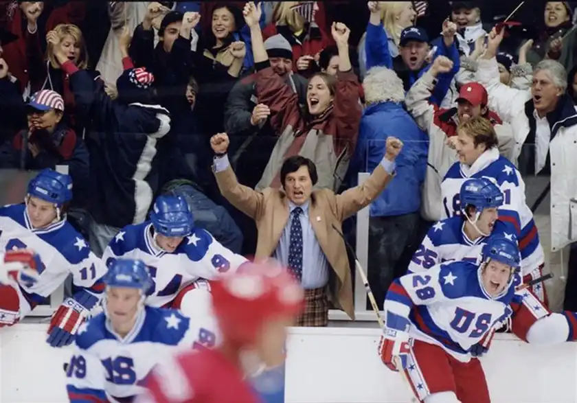 A coach cheers during a ice hockey match in the film Miracle
