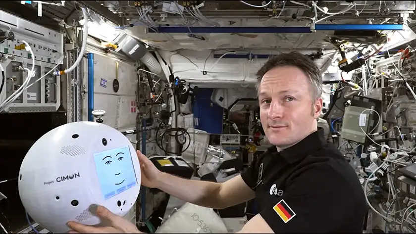 Astronaut Matthias Maurer and CIMON (robotic companion) on the space station in the film Space: The Longest Goodbye