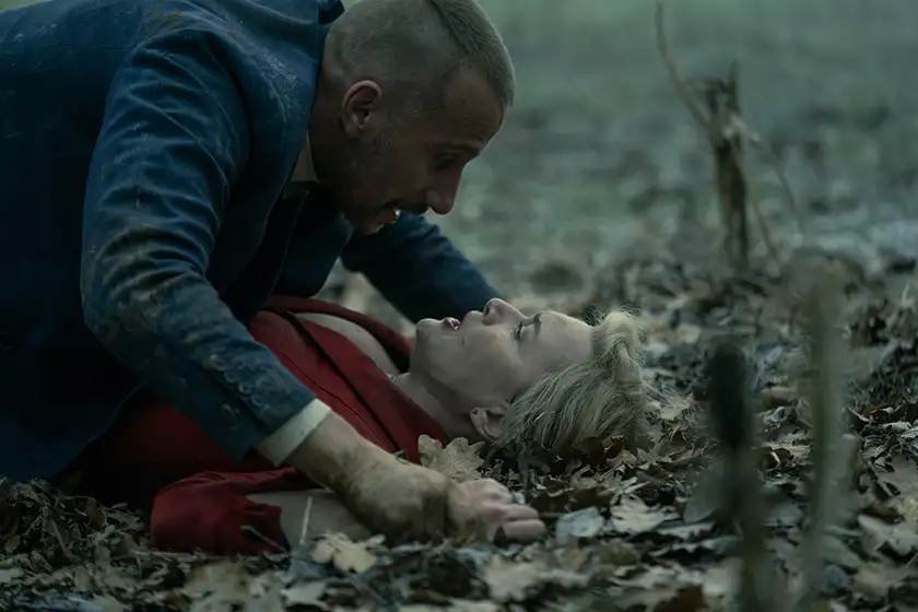 Matthias Schoenaerts lies on top of Kate Winslet in the woods in the series finale of The Regime