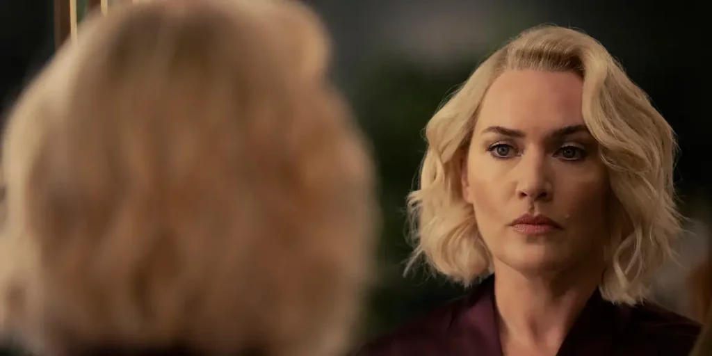 Kate Winslet looks at herself in the mirror in the series finale of The Regime