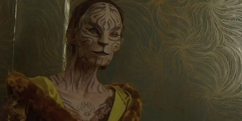 Eugenie Bondurant, who is Tigris Snow in the Hunger Games sequels, has a face that resembles a cat