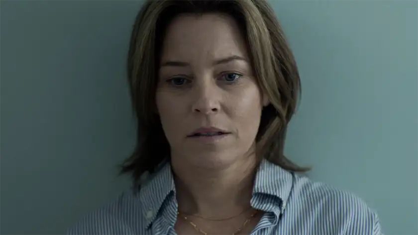 Elizabeth Banks looks down, leaning on a blue wall, in the movie A Mistake, one of the 15 films to watch at the Tribeca Film Festival according to Loud and Clear Reviews