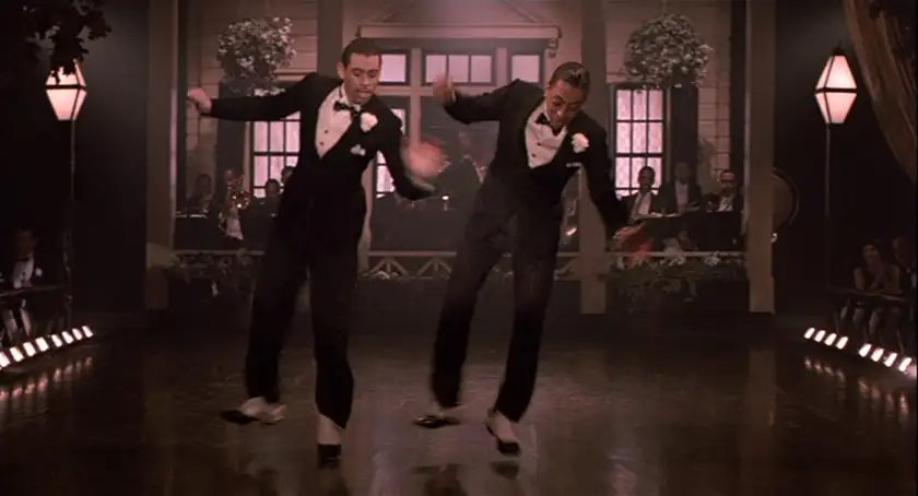 Two men tap dance in the film The Cotton Club, one of all Francis Ford Coppola movies ranked from worst to best by Loud and Clear Reviews