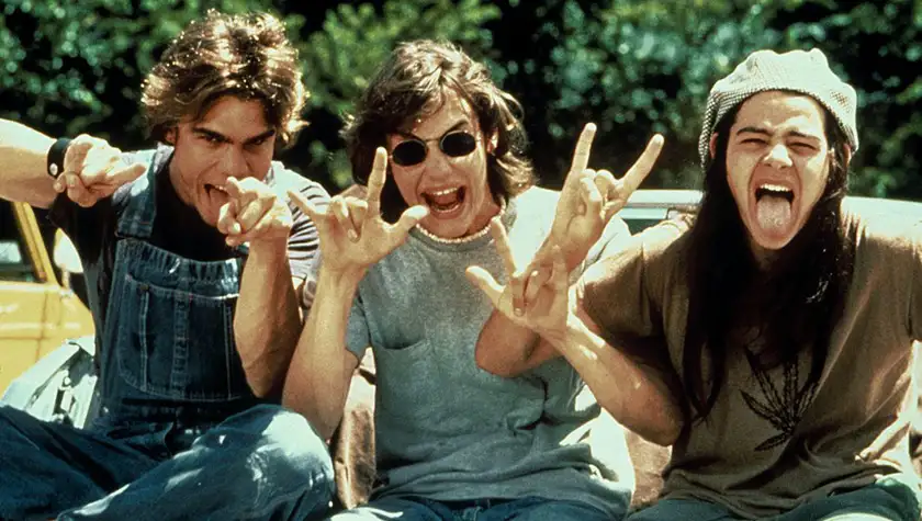 Teenagers make gestures to the camera in Dazed and Confused