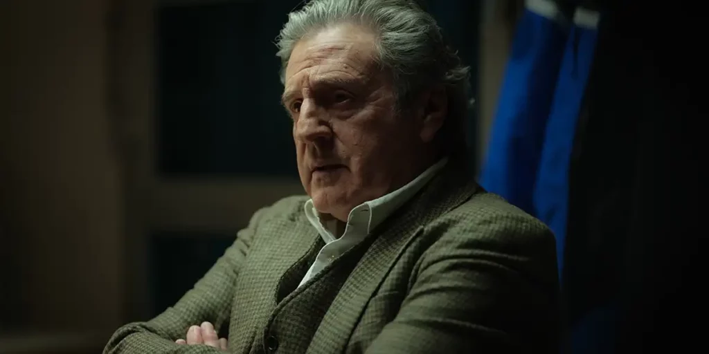 Daniel Auteuil sits with his arms crossed in the film Le Fil (An Ordinary Case), featured in the Loud and Clear interview