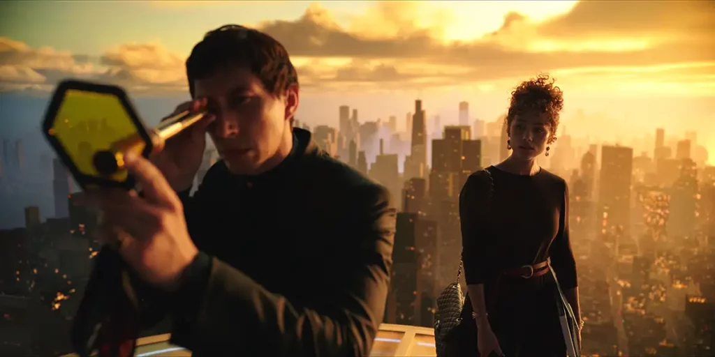 A man looks through a telescope with a woman behind him and yellow sky in the film Megalopolis