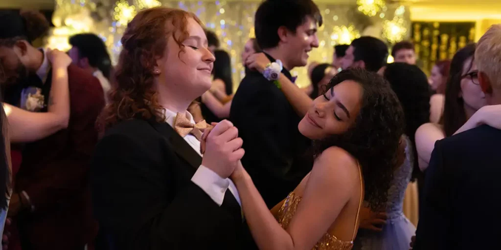 Two girls dance at prom in the Hulu film Prom Dates
