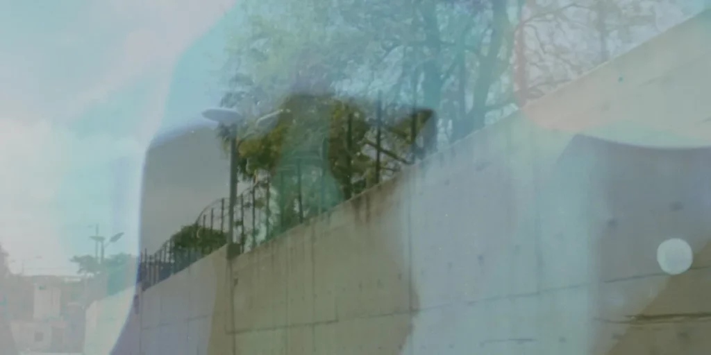An abstract image over a stone wall in the film A Stone's Throw