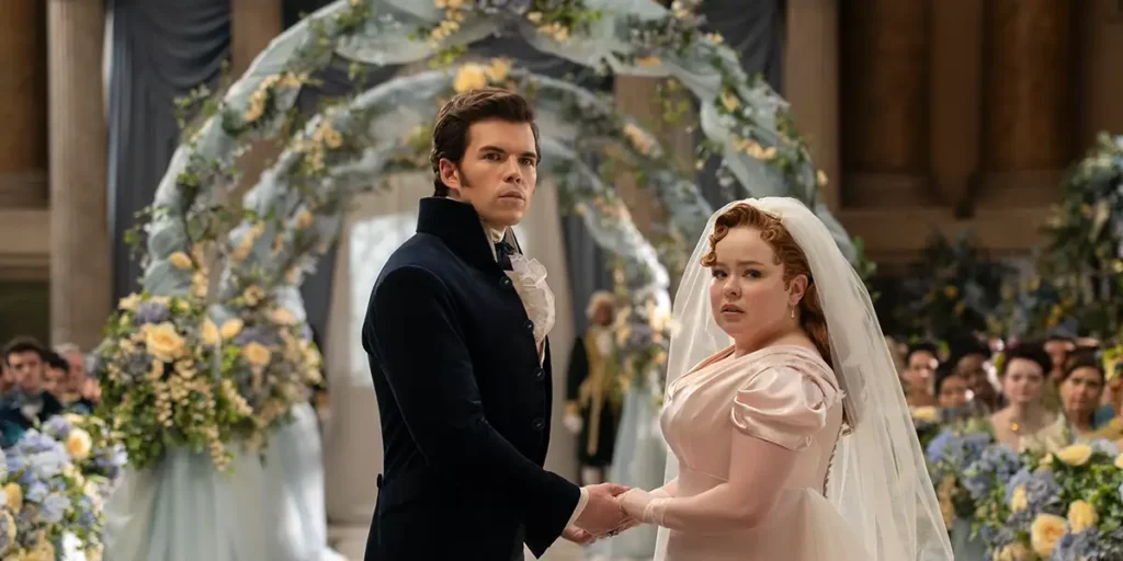 A bride and a groom hold hands looking back in season 3 part 2 of Bridgerton