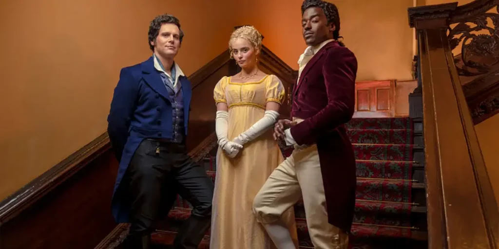 Three people stand on stairs wearing historical clothes in Season 1 Episode 6 of Doctor Who