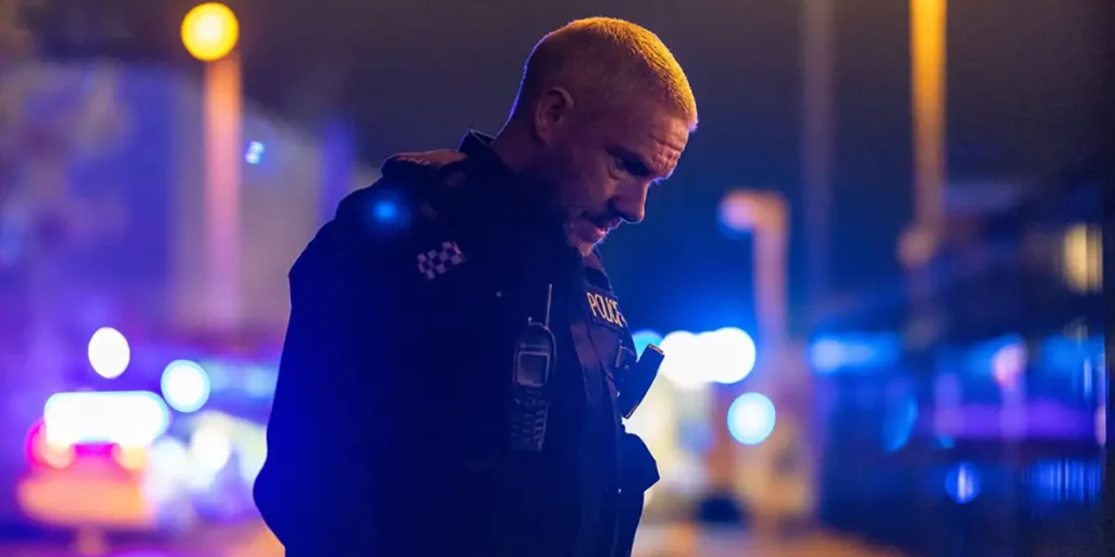 Martin Freeman, a policeman, looks down at night in the BBC series The Responder Season 2