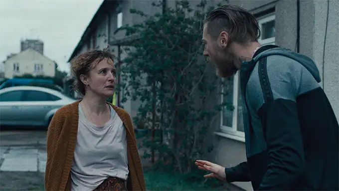 A woman and a man argue in the street in the 2024 film Restless