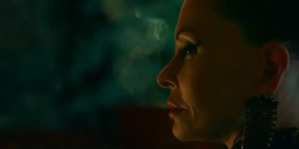 The outline of the left side of the face of a woman against a green background in the film Trim Season