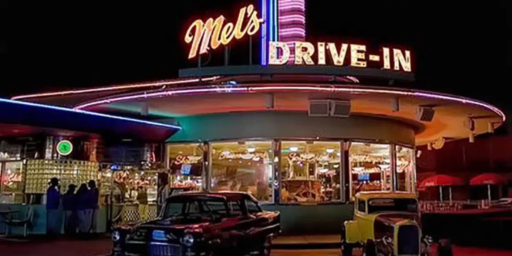 A nighttime shot of Mel's Drive In in the film American Graffiti