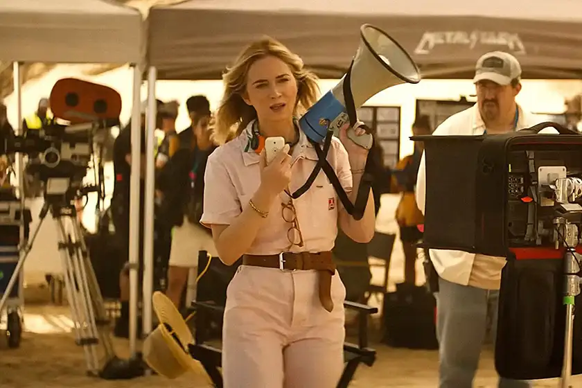 Emily Blunt holds a megaphone in The Fall Guy, in a still featured in a Loud and Clear Reviews article about how movie theaters can save themselves