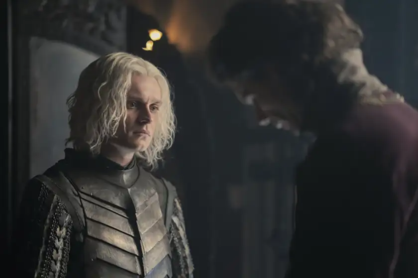 A knight talks to another man in season 2 episode 3 of House of the Dragon, from a photo featured on Loud and Clear's review and recap