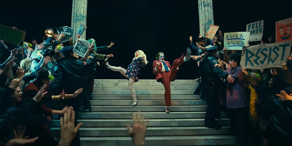Lady Gaga and Joaquin Phoenix dance on the stairs in Joker: Folie à Deux, featured in an article with everything we know about Joker 2