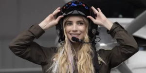 Rex (Emma Roberts) lifts up her helmet in Space Cadet