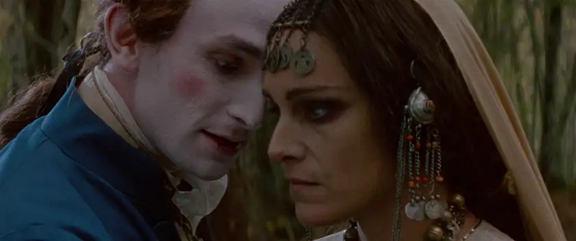 A vampire looks at a woman's neck in the film The Vourdalak