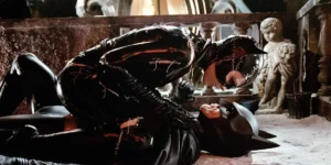 Catwoman lies on top of Batman in the film Batman Returns