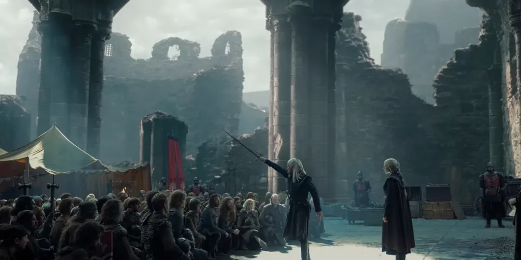 A man raises a sword to a crowd in Season 2 Episode 8, the season 2 finale, of House of the Dragon