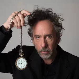 Tim Burton holds up a watch