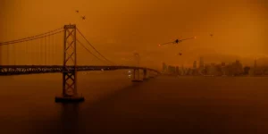 A shot of a bridge on the water against an orange sky in Asif Kapadia's dystopian film 2073