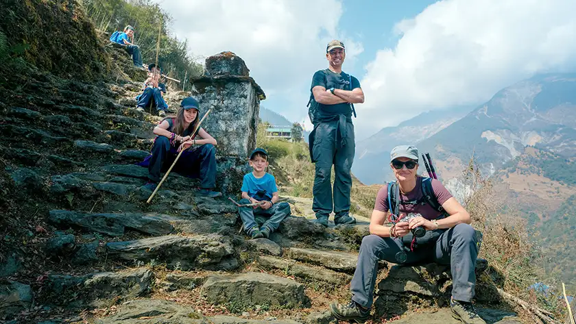 Leo, Colin, Laurent, Mia, Sebastien Pelletier, a local sherpa, and Edith Lemay take a brief rest while trekking to the Poon Hill viewpoint in Nepal, in a still from the film BLINK