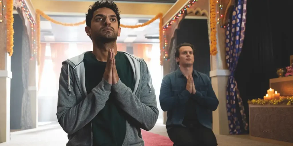 An indian man has his arms in prayer in A Nice Indian Boy