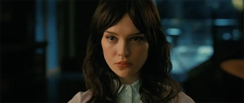 A brown haired woman looks serious in a still from Companion, one of the 10 anticipated movies to watch in January 2025