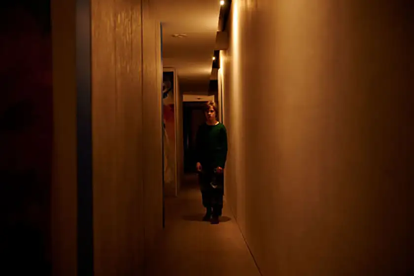 A child in a corridor in a still from Daddy's Head