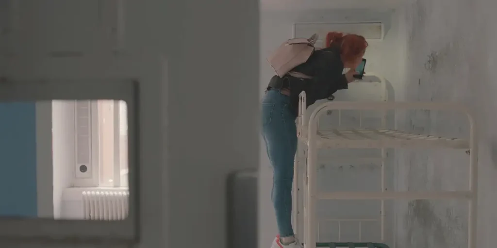 A woman takes a picture in Holloway prison from the 2024 documentary