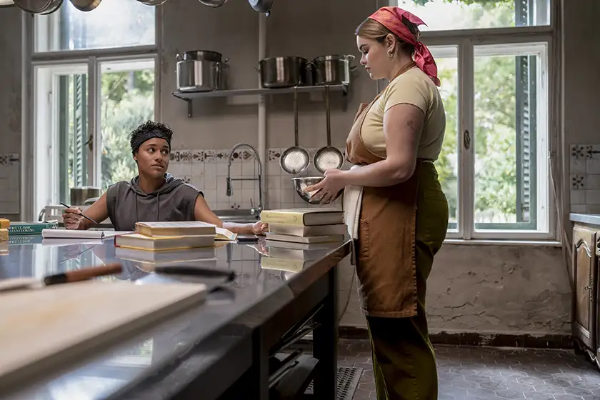 Ariana DeBose as Chef and Barbie Ferreira as Lucia in House of Spoils