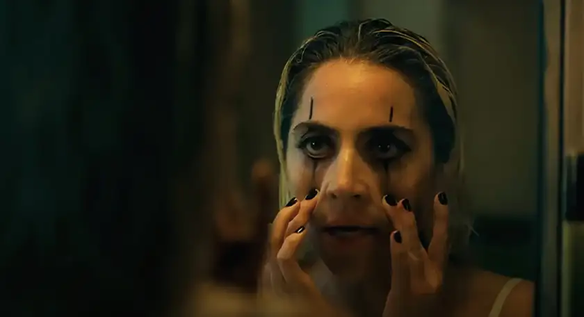 Lady Gaga puts on smudged eye makeup as Lee Quinzel in Joker 2, the 2024 sequel from Todd Phillips