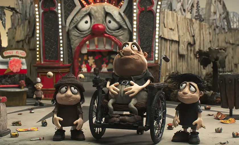 A character in a wheelchair with a child on each side, all made in stop motion, in the film Memoir of a Snail