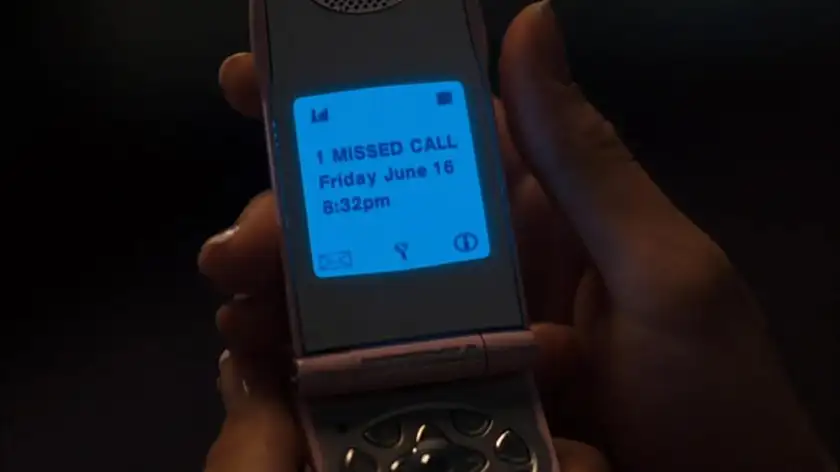 A phone screen in a still from One Missed Call (2008), featured in an article where we watched The Ring (2002) seven times in seven days