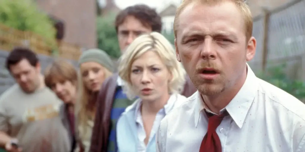 Nick Frost, Simon Pegg and three more people look confused in Shaun of the Dead