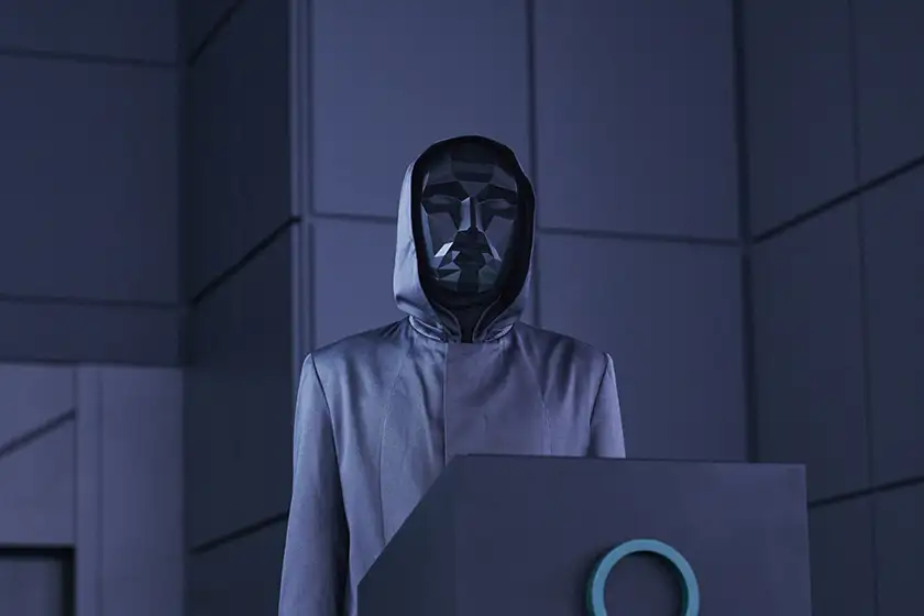 A man wears a black mask in season 2 of Netflix's Squid Game, about which we make predictions in this article