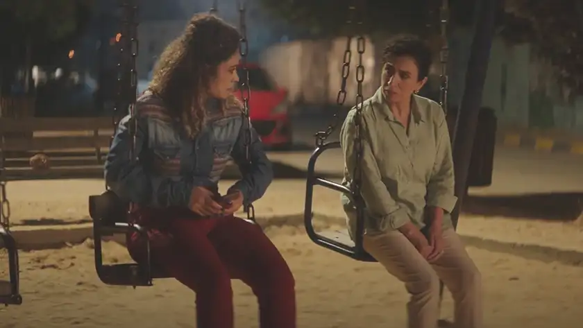 Two women on swings in the film Thank You for Banking with Us