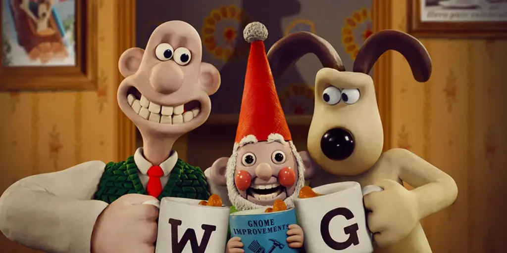 An animated dog, man, and gnome clink mugs in a toastin a still from the 2024 film Wallace & Gromit: Vengeance Most Fowl