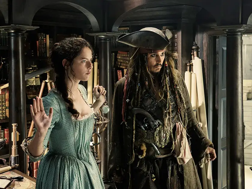 Kaya Scodelario and Johnny Depp in a still from Dead Men Tell No Tales, featured in an article with everything we know about Pirates of the Caribbean 6