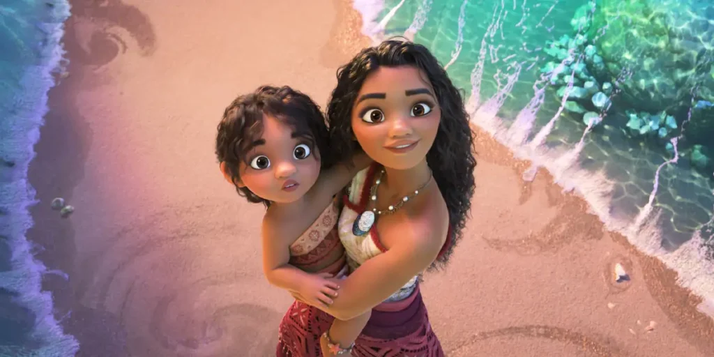 Moana (voice of Auli‘i Cravalho) holds a baby at the beach looking up in Moana 2