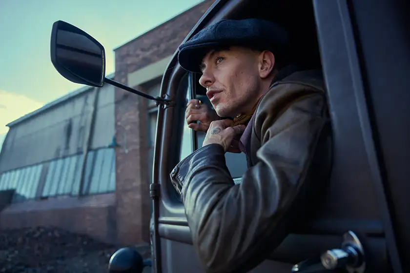 Barry Keoghan looks out of a truck window in the first look still from the Peaky Blinders movie, in a photo featured in an article with everything we know about the film